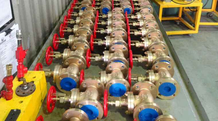 A bench filled with valves awaiting NATA testing