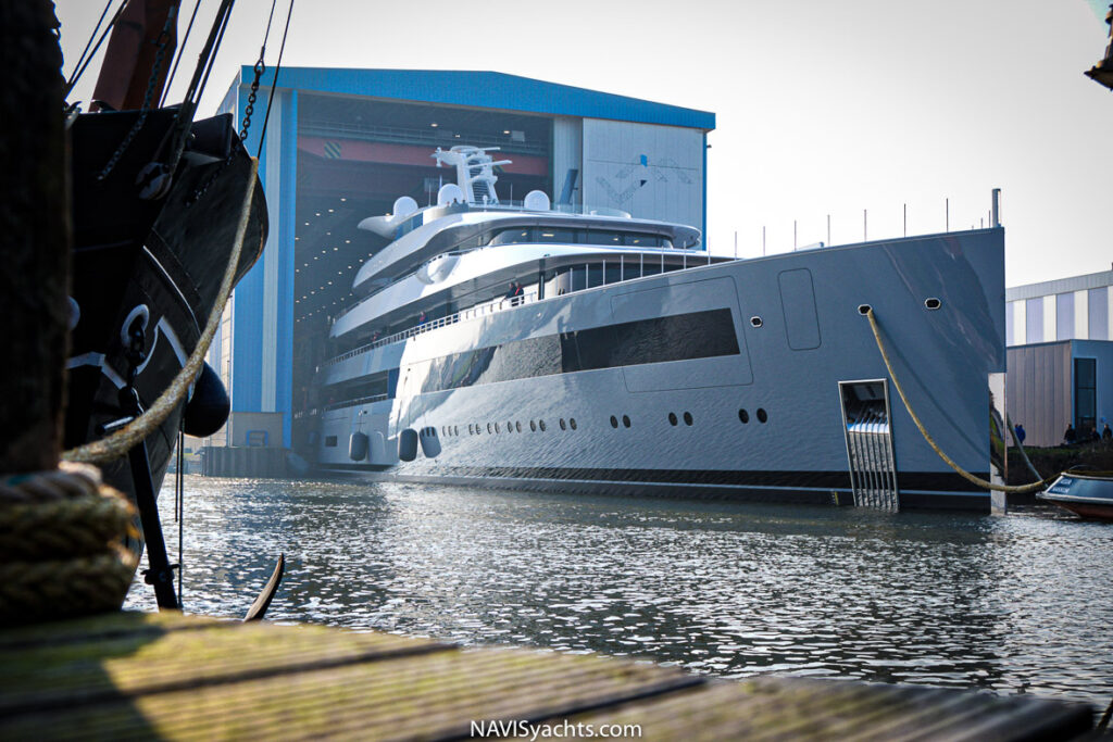 A massive 100m luxury yacht leaving the factory