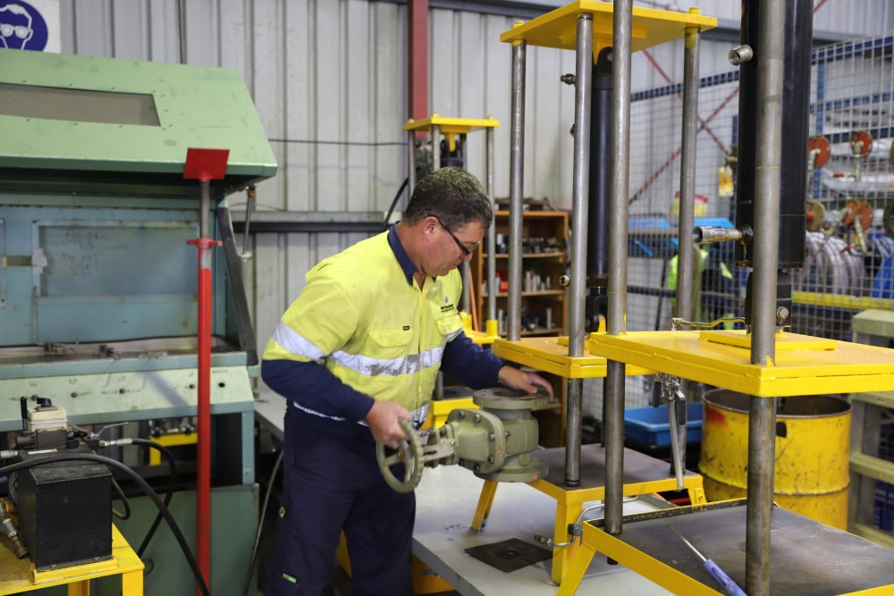 A valve being placed into a press test rig, as part of a equipment certification test at WATMAR's NATA approved laboratory in Perth's head office.