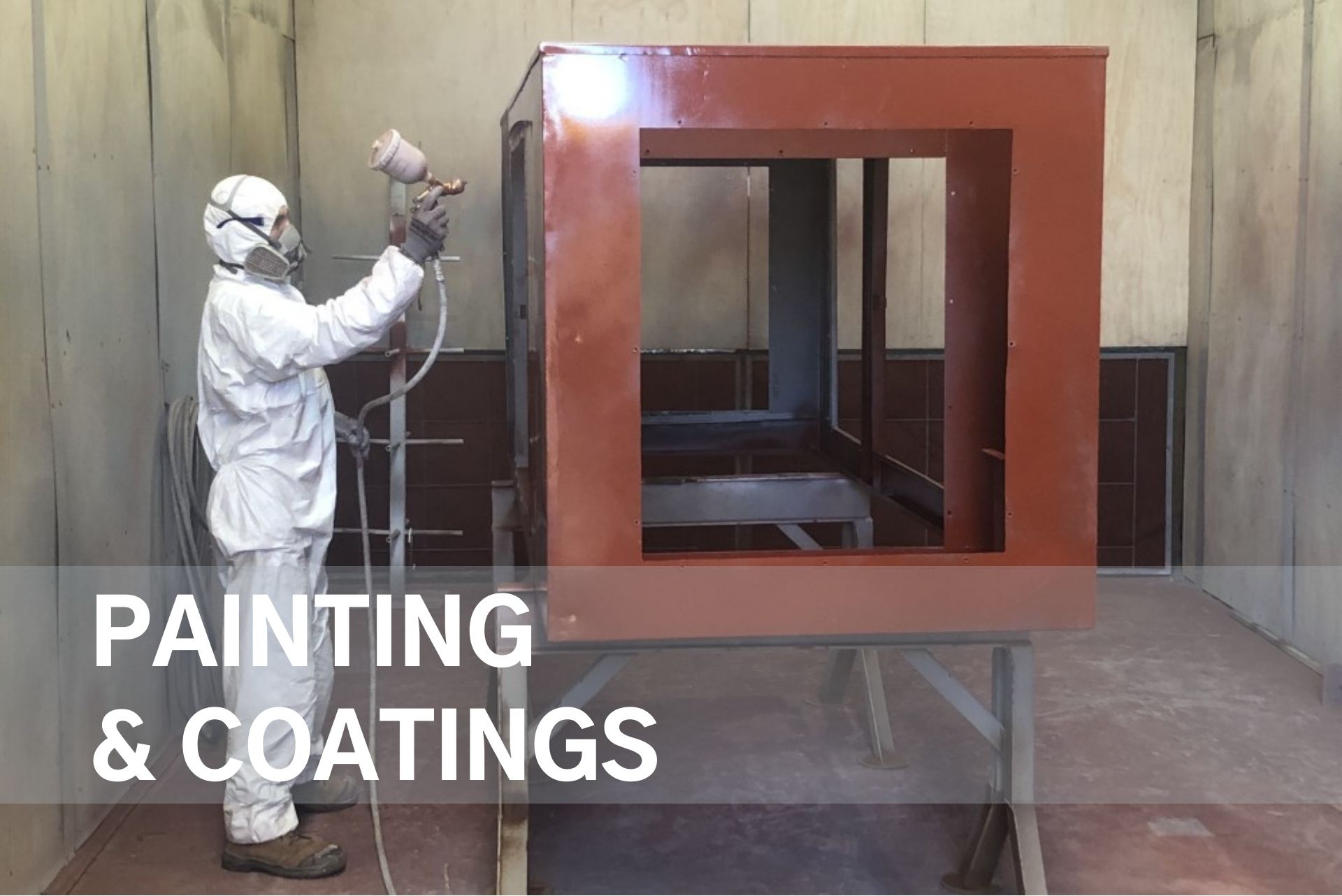 Inside the dedicated paint booth, WATMAR spray painting another manufactured product